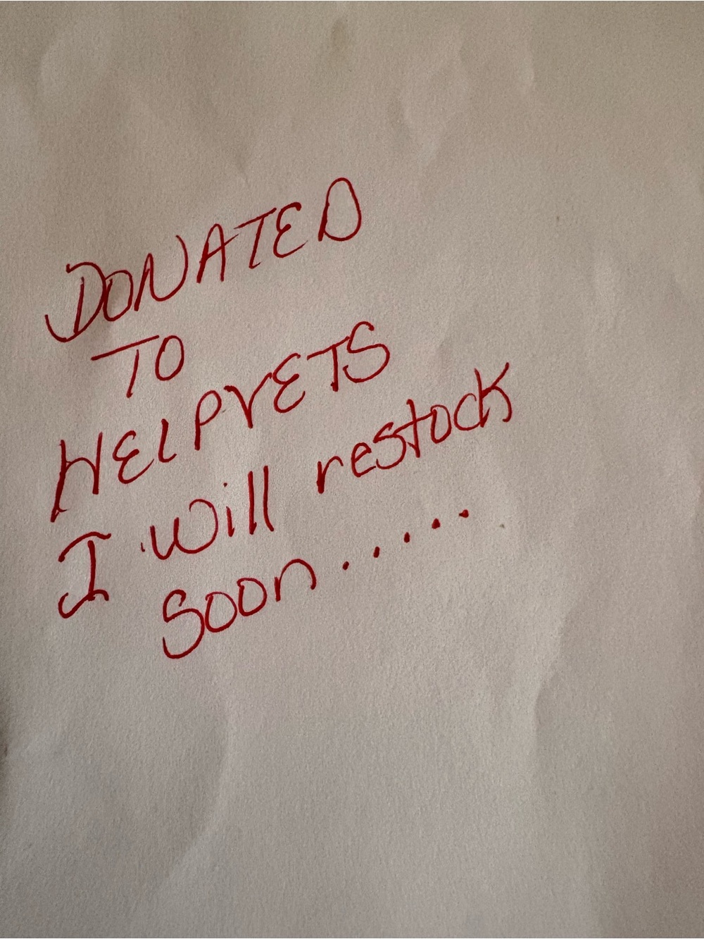 Handwritten Note - Red Ink on White Paper